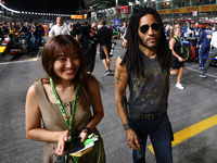 Lenny Kravitz walks on the grid ahead of the F1 Grand Prix of Singapore at Marina Bay Street Circuit in Singapore, Singapore, on September 2...