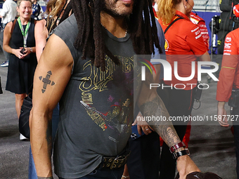 Lenny Kravitz walks on the grid ahead of the F1 Grand Prix of Singapore at Marina Bay Street Circuit in Singapore, Singapore, on September 2...