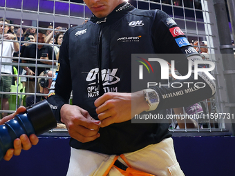 Lando Norris of the United Kingdom and McLaren Formula 1 Team prepares for the race on the grid ahead of the F1 Grand Prix of Singapore at M...