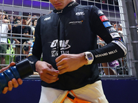 Lando Norris of the United Kingdom and McLaren Formula 1 Team prepares for the race on the grid ahead of the F1 Grand Prix of Singapore at M...