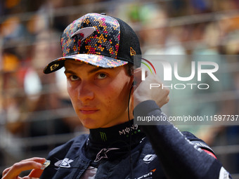 Oscar Piastri of Australia and the McLaren Formula 1 Team stand on the grid ahead of the F1 Grand Prix of Singapore at Marina Bay Street Cir...