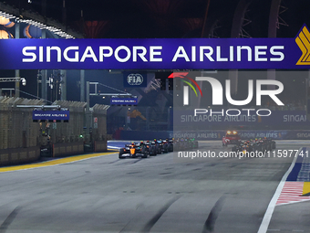 Cars line up on the starting grid during the F1 Grand Prix of Singapore at Marina Bay Street Circuit in Singapore, Singapore, on September 2...