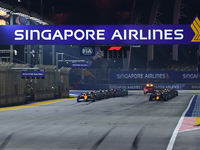 Cars line up on the starting grid during the F1 Grand Prix of Singapore at Marina Bay Street Circuit in Singapore, Singapore, on September 2...