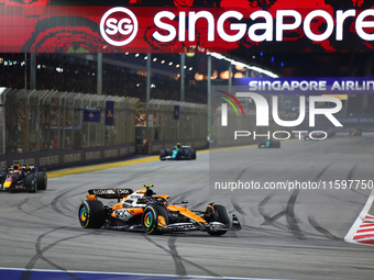 Lando Norris of the United Kingdom drives the McLaren Formula 1 Team MCL38 during the F1 Grand Prix of Singapore at Marina Bay Street Circui...