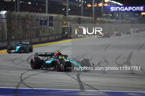 Lewis Hamilton of the United Kingdom drives the Mercedes-AMG Petronas F1 Team F1 W15 during the F1 Grand Prix of Singapore at Marina Bay Str...