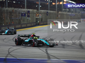 Lewis Hamilton of the United Kingdom drives the Mercedes-AMG Petronas F1 Team F1 W15 during the F1 Grand Prix of Singapore at Marina Bay Str...