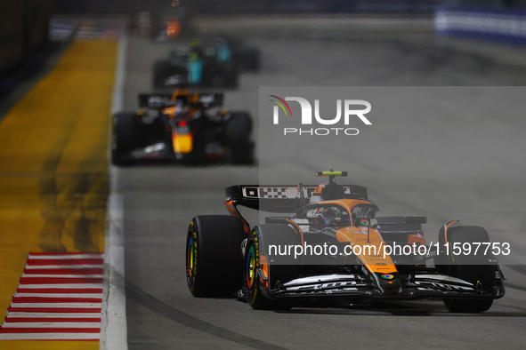 Lando Norris of the United Kingdom drives the McLaren Formula 1 Team MCL38 during the F1 Grand Prix of Singapore at Marina Bay Street Circui...