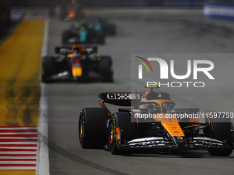 Lando Norris of the United Kingdom drives the McLaren Formula 1 Team MCL38 during the F1 Grand Prix of Singapore at Marina Bay Street Circui...