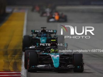 Lewis Hamilton of the United Kingdom drives the Mercedes-AMG Petronas F1 Team F1 W15 during the F1 Grand Prix of Singapore at Marina Bay Str...