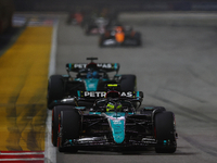 Lewis Hamilton of the United Kingdom drives the Mercedes-AMG Petronas F1 Team F1 W15 during the F1 Grand Prix of Singapore at Marina Bay Str...