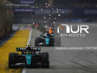 Lewis Hamilton of the United Kingdom drives the Mercedes-AMG Petronas F1 Team F1 W15 during the F1 Grand Prix of Singapore at Marina Bay Str...