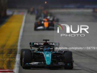 George Russell of the United Kingdom drives the Mercedes-AMG Petronas F1 Team F1 W15 during the F1 Grand Prix of Singapore at Marina Bay Str...