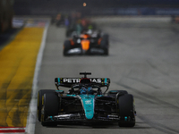 George Russell of the United Kingdom drives the Mercedes-AMG Petronas F1 Team F1 W15 during the F1 Grand Prix of Singapore at Marina Bay Str...