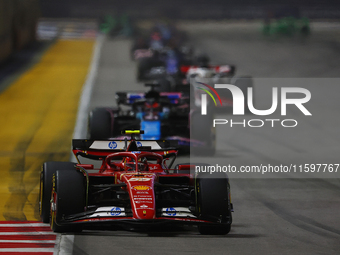 Carlos Sainz of Spain drives the Scuderia Ferrari SF-24 during the F1 Grand Prix of Singapore at Marina Bay Street Circuit in Singapore, Sin...