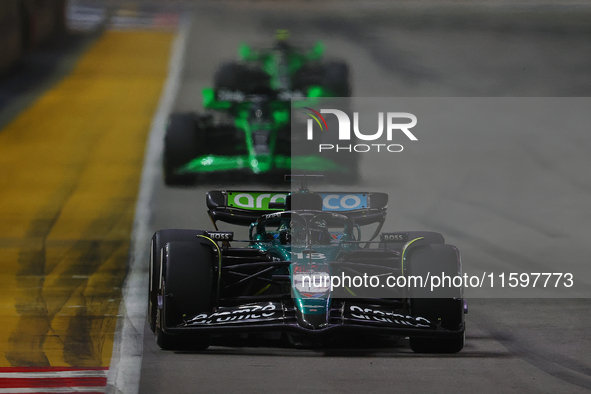 Lance Stroll of Canada drives the Aston Martin Aramco F1 Team AMR25 during the F1 Grand Prix of Singapore at Marina Bay Street Circuit in Si...