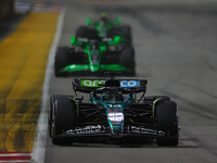 Lance Stroll of Canada drives the Aston Martin Aramco F1 Team AMR25 during the F1 Grand Prix of Singapore at Marina Bay Street Circuit in Si...