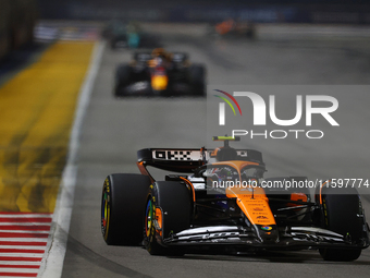 Lando Norris of the United Kingdom drives the McLaren Formula 1 Team MCL38 during the F1 Grand Prix of Singapore at Marina Bay Street Circui...