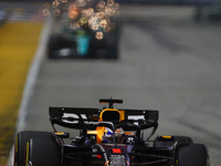 Max Verstappen of the Netherlands drives the Red Bull Racing-Honda RBPT RB20 during the F1 Grand Prix of Singapore at Marina Bay Street Circ...