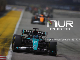 George Russell of the United Kingdom drives the Mercedes-AMG Petronas F1 Team F1 W15 during the F1 Grand Prix of Singapore at Marina Bay Str...