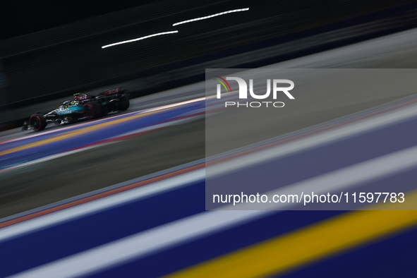 Lewis Hamilton of the United Kingdom drives the Mercedes-AMG Petronas F1 Team F1 W15 during the F1 Grand Prix of Singapore at Marina Bay Str...