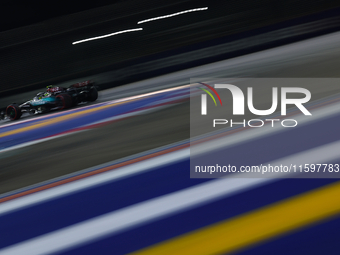 Lewis Hamilton of the United Kingdom drives the Mercedes-AMG Petronas F1 Team F1 W15 during the F1 Grand Prix of Singapore at Marina Bay Str...