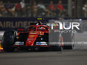 Carlos Sainz of Spain drives the Scuderia Ferrari SF-24 during the F1 Grand Prix of Singapore at Marina Bay Street Circuit in Singapore, Sin...