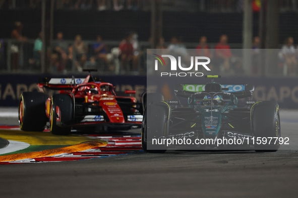 Fernando Alonso of Spain drives the Aston Martin Aramco F1 Team AMR24 during the F1 Grand Prix of Singapore at Marina Bay Street Circuit in...