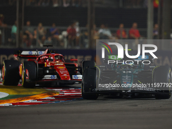 Fernando Alonso of Spain drives the Aston Martin Aramco F1 Team AMR24 during the F1 Grand Prix of Singapore at Marina Bay Street Circuit in...