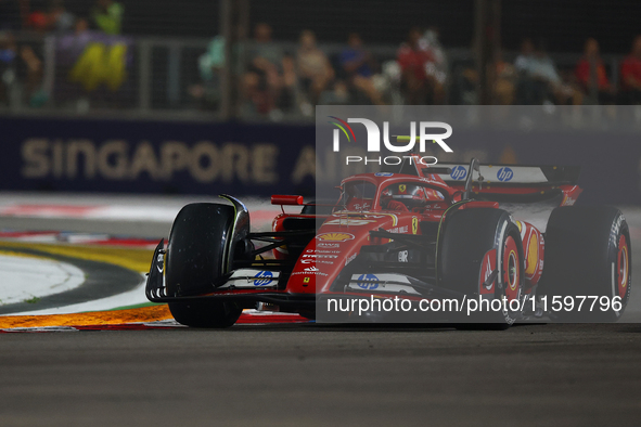 Carlos Sainz of Spain drives the Scuderia Ferrari SF-24 during the F1 Grand Prix of Singapore at Marina Bay Street Circuit in Singapore, Sin...