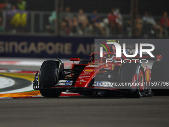 Carlos Sainz of Spain drives the Scuderia Ferrari SF-24 during the F1 Grand Prix of Singapore at Marina Bay Street Circuit in Singapore, Sin...