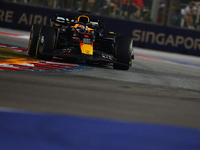 Max Verstappen of the Netherlands drives the Red Bull Racing-Honda RBPT RB20 during the F1 Grand Prix of Singapore at Marina Bay Street Circ...