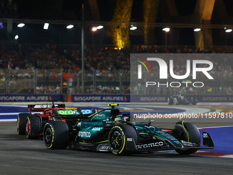 Fernando Alonso of Spain drives the Aston Martin Aramco F1 Team AMR24 during the F1 Grand Prix of Singapore at Marina Bay Street Circuit in...