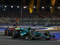 Fernando Alonso of Spain drives the Aston Martin Aramco F1 Team AMR24 during the F1 Grand Prix of Singapore at Marina Bay Street Circuit in...