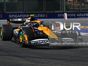 Lando Norris of the United Kingdom drives the McLaren Formula 1 Team MCL38 during the F1 Grand Prix of Singapore at Marina Bay Street Circui...