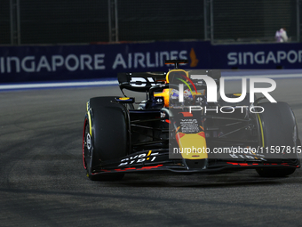 Max Verstappen of the Netherlands drives the Red Bull Racing-Honda RBPT RB20 during the F1 Grand Prix of Singapore at Marina Bay Street Circ...