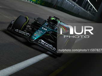 Lance Stroll of Canada drives the Aston Martin Aramco F1 Team AMR25 during the F1 Grand Prix of Singapore at Marina Bay Street Circuit in Si...