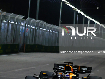 Max Verstappen of the Netherlands drives the Red Bull Racing-Honda RBPT RB20 during the F1 Grand Prix of Singapore at Marina Bay Street Circ...