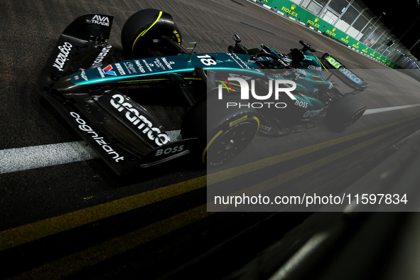 Lance Stroll of Canada drives the Aston Martin Aramco F1 Team AMR25 during the F1 Grand Prix of Singapore at Marina Bay Street Circuit in Si...