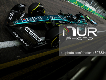 Lance Stroll of Canada drives the Aston Martin Aramco F1 Team AMR25 during the F1 Grand Prix of Singapore at Marina Bay Street Circuit in Si...