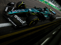 Lance Stroll of Canada drives the Aston Martin Aramco F1 Team AMR25 during the F1 Grand Prix of Singapore at Marina Bay Street Circuit in Si...