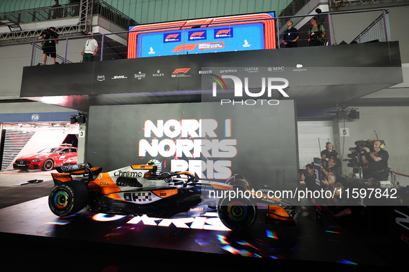 Lando Norris of the United Kingdom and McLaren Formula 1 Team celebrates victory during the F1 Grand Prix of Singapore at Marina Bay Street...