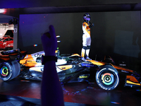 Lando Norris of the United Kingdom and McLaren Formula 1 Team celebrates victory during the F1 Grand Prix of Singapore at Marina Bay Street...