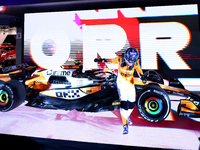 Lando Norris of the United Kingdom and McLaren Formula 1 Team celebrates victory during the F1 Grand Prix of Singapore at Marina Bay Street...