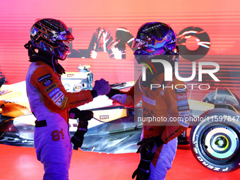 Oscar Piastri of Australia and the McLaren Formula 1 Team and Lando Norris of the United Kingdom and the McLaren Formula 1 Team embrace duri...