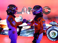 Oscar Piastri of Australia and the McLaren Formula 1 Team and Lando Norris of the United Kingdom and the McLaren Formula 1 Team embrace duri...