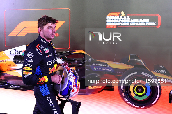 Max Verstappen of the Netherlands and Red Bull Racing-Honda RBPT reacts during the F1 Grand Prix of Singapore at Marina Bay Street Circuit i...