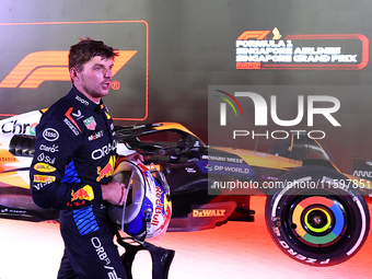 Max Verstappen of the Netherlands and Red Bull Racing-Honda RBPT reacts during the F1 Grand Prix of Singapore at Marina Bay Street Circuit i...