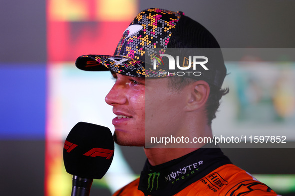 Lando Norris of the United Kingdom and McLaren Formula 1 Team celebrates winning the F1 Grand Prix of Singapore at Marina Bay Street Circuit...