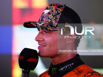 Lando Norris of the United Kingdom and McLaren Formula 1 Team celebrates winning the F1 Grand Prix of Singapore at Marina Bay Street Circuit...