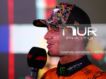 Lando Norris of the United Kingdom and McLaren Formula 1 Team celebrates winning the F1 Grand Prix of Singapore at Marina Bay Street Circuit...